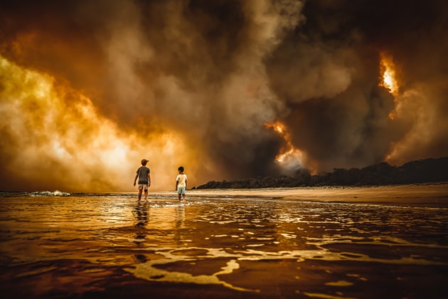 © Martin Von Stoll. Beauty and the Beast. Winner of the Single Shot category of Australasia's Top Emerging Photographers 2020. Captured at Black Head Beach during the NSW bushfires in later 2019.