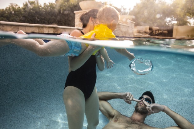 Michael & Nicole Phelps Swimming with Boomer. &copy; Fernando Decillis