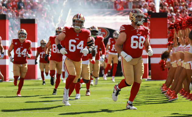 The San Francisco 49ers run out for the must-win match, led out by number 64, centre, Jake Brendel. Canon R3, Sigma 120-300mm lens @ 120mm. 1/2000s @ f4, ISO 320.