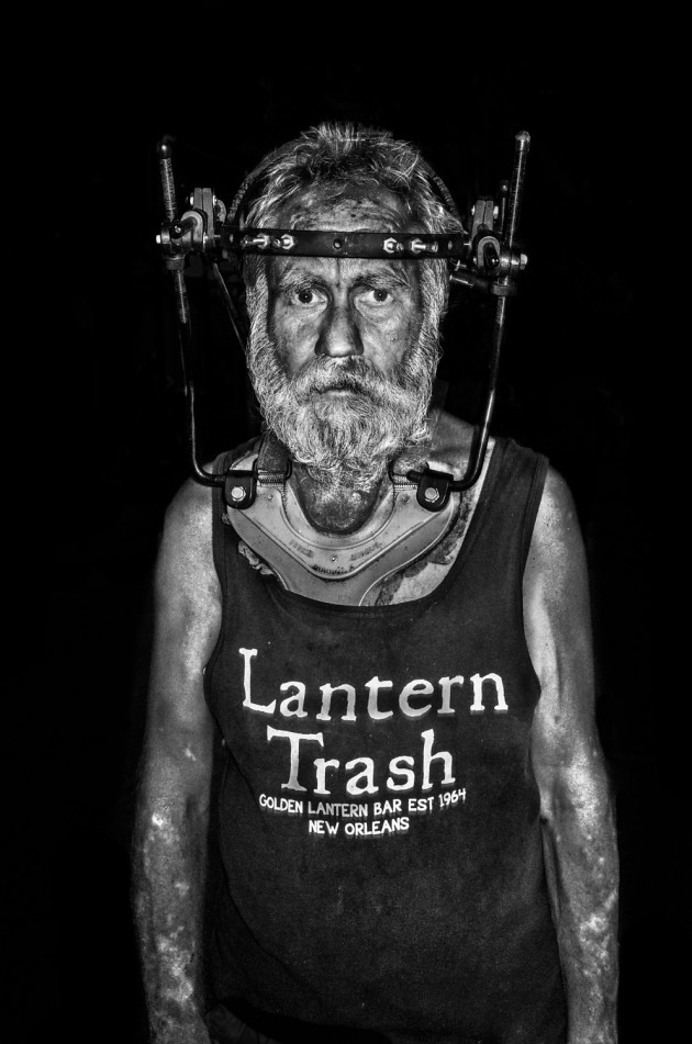 LANTERN TRASH, NEW ORLEANS MS: This guy was collecting glasses at the Lantern Trash Bar for coins. He told me he had an accident but could not afford to have his head brace removed so he was raising money however he could. Image: Meg Hewitt