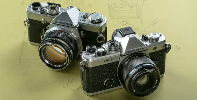 The original Olympus OM1 (1972) next to the OM SYSTEM OM3.
