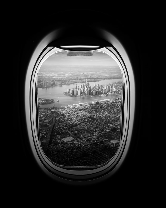 © Jason M. Peterson. Jim Jarmusch. “Taken on the approach to NYC in seat 1A. Early morning perfect light. I’ve shot this photo a hundred times and never like this one.”