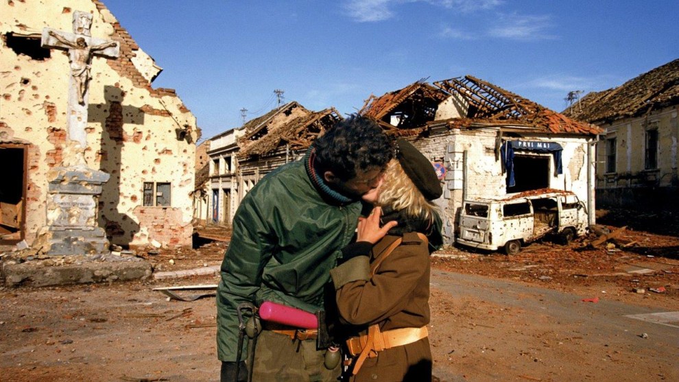 &copy; Ron Haviv/VII. A Serbian couple kisses after the fall of Vukovar, Croatia, 1991.
