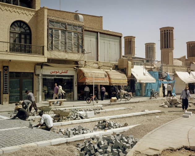 © Sarah Pannell. Bricklayers work in the blistering heat to restore a pedestrian area out the front of the Amir Chakhmaq Mosque in Yazd, Iran, September, 2016. From Tabriz to Shiraz.