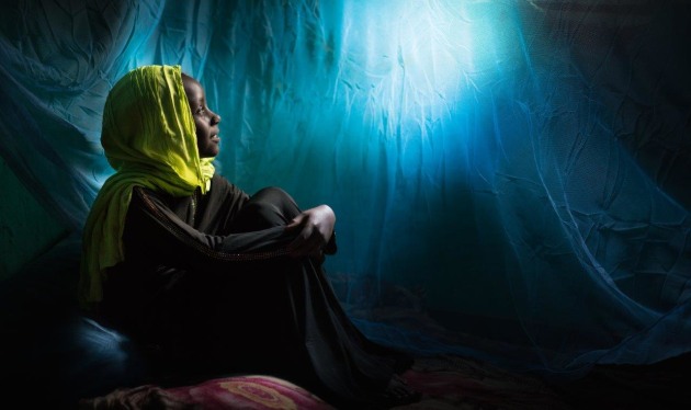 © Simon Lister. Portrait of a girl in her bedroom with a mosquito net, Jijiga, Ethiopia.