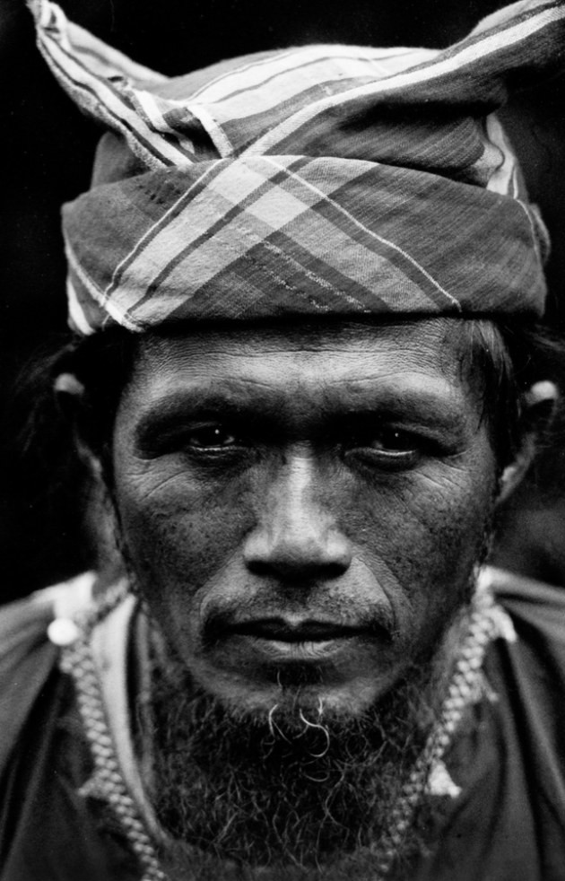 Mindanao, southern Philippines, 1996.
Datu Magoling of the indigenous B’laan tribe.
Datu (Chief) Magoling refused to accept a bribe from an Australian gold mining company and local government officials, who had paid him a visit threatening reprisals if mining did not go ahead. One month later the B'laan people were machine gunned, bombed and had their property destroyed by the Philippine military in the company’s (WMC) mining concession area. Eight B’laan people were killed and 120 families displaced.
I travelled with a medical relief and fact-finding mission for a week in the mountains of the southern Philippine island to document the events that had occurred two weeks before. Image: Glenn Lockitch